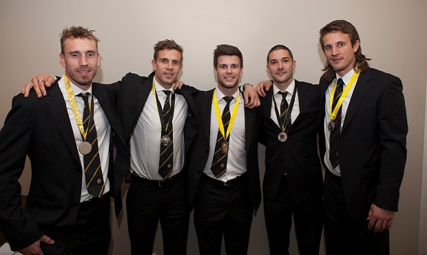 2012 Jack Dyer Medal winner Trent Cotchin win the remainder of the top 5 pose for a photo celebrating their wins.